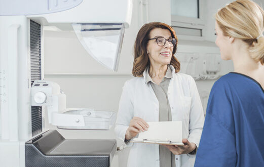 Doctor discusses test with patient before mammogram