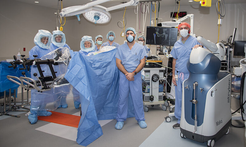 Group of doctors and nurses in masks and scrubs