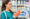 Woman checking nutrition labels at grocery store