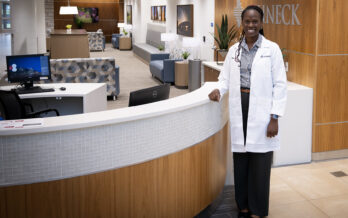 Dr. Igwe pictured in the Schneck Professional Building Lobby