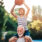Older man with a boy on his shoulders holding a basketball