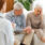 Stressed elderly couple talking to doctor