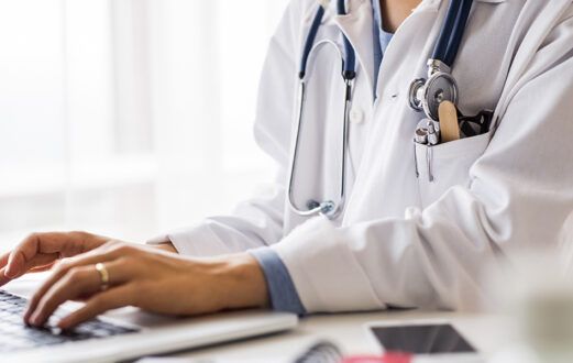 Doctor working at computer