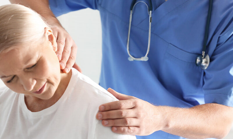 Woman receiving treatment from doctor