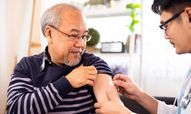 Man receives his flu vaccine