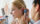 doctor checking girl's ear
