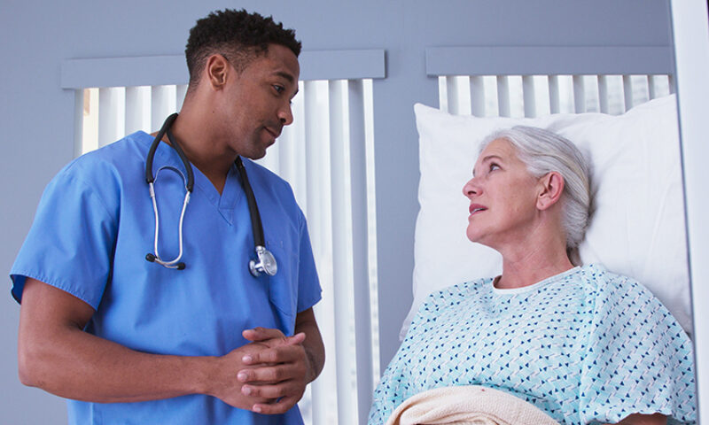 A doctor talking with a patient