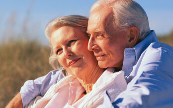 Elderly man and woman in embrace