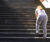 Woman taking rest while walking up stairs