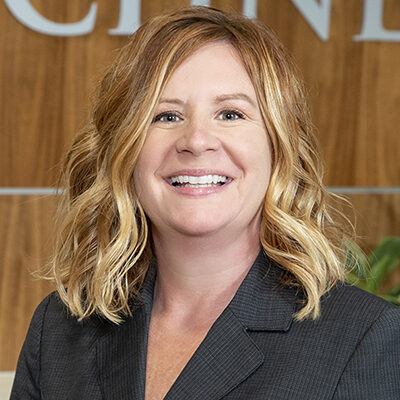 Close up photo of Kathy Covert, Schneck Vice President of Workforce and Organizational Excellence.  He has reddish-blond hair and is wearing a dark gray suit jacket.