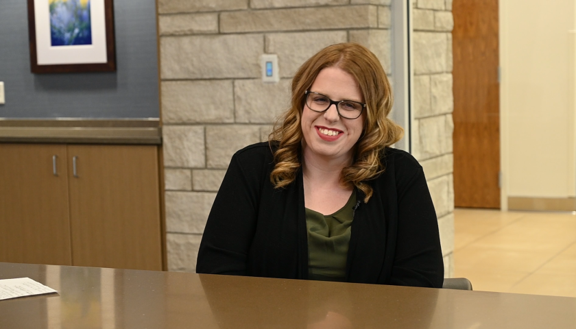 Photo of a person sitting at a table