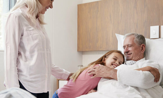 young girl goes with grandma to visit grandpa in hospital