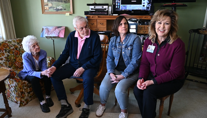 Photo of four people sitting together