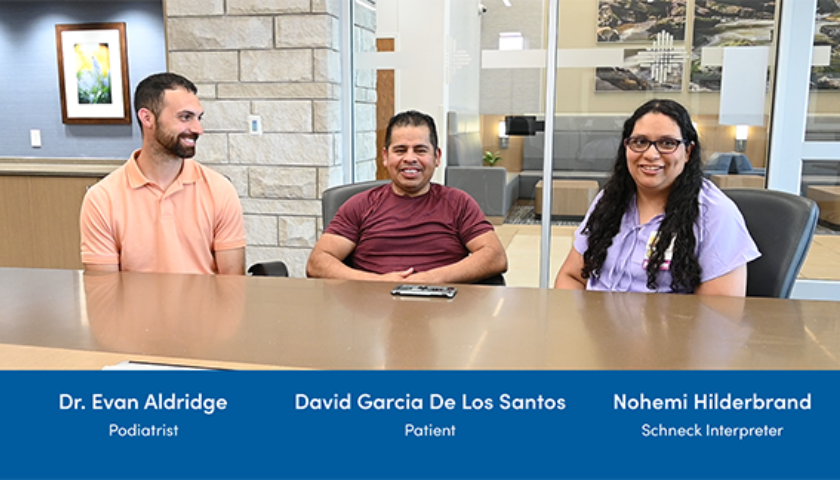 Dr. Evan Aldridge, David Garcia De Los Santos, and Nohami Hilderbrand smiling for a picture