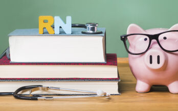 Stack of books and piggy bank with glasses