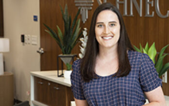 Dr. Courtney Laubach is shown standing in the Schneck Professional Building lobby