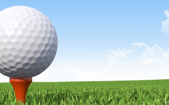 Image of a golf tee with a golf ball sitting on it.