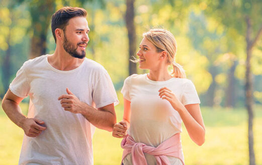 photo of couple running and talking to each other