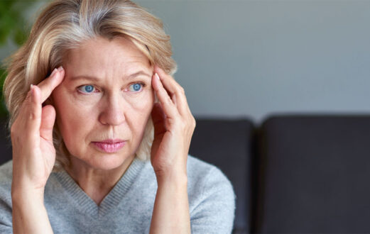 Photo of woman rubbing her temples