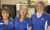 Three Volunteers smiling