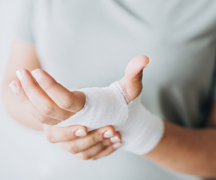 hand wrapped in gauze bandages